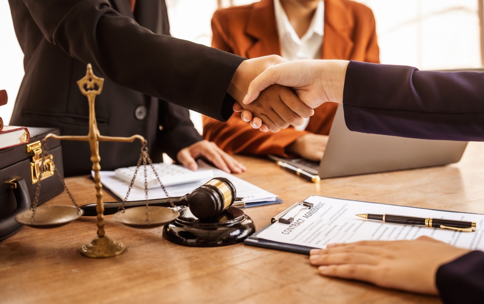 Legal professionals concluding a commercial agreement